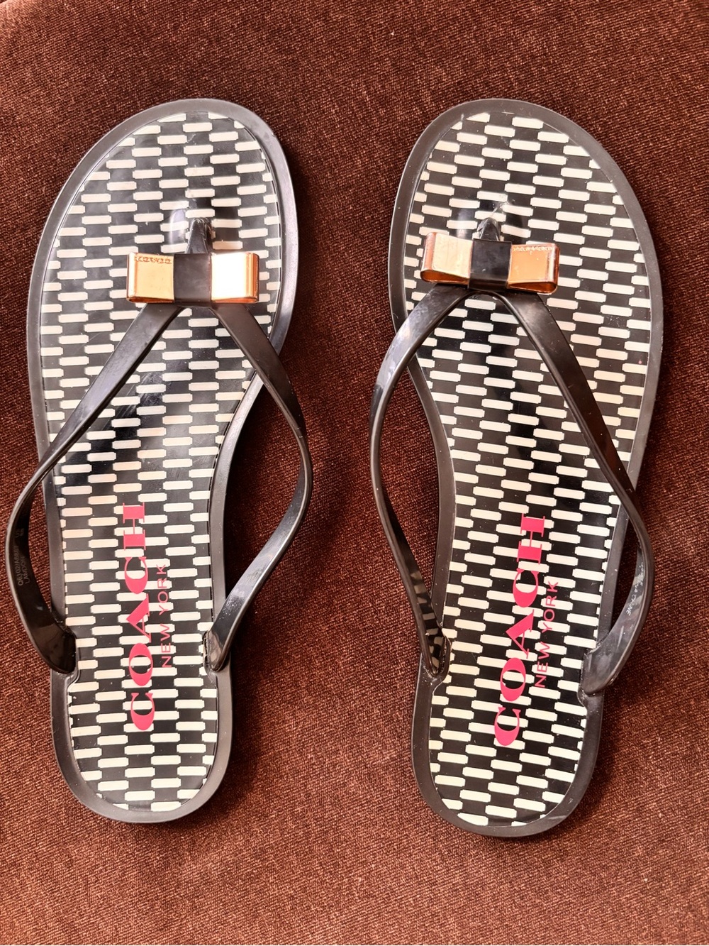 COACH Black Logo Pattern Bow Thong Sandals with Gold Accent